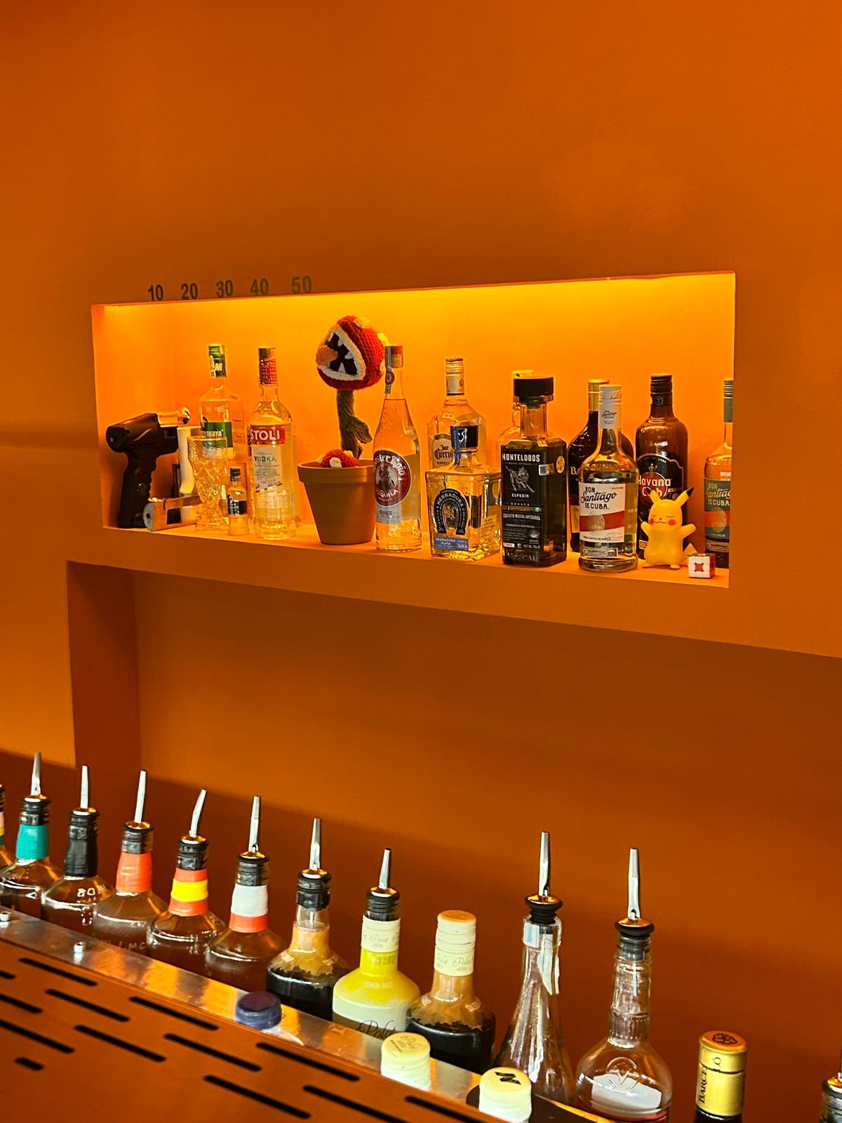 GLITCH Bar's cocktail bar and drinks shelves